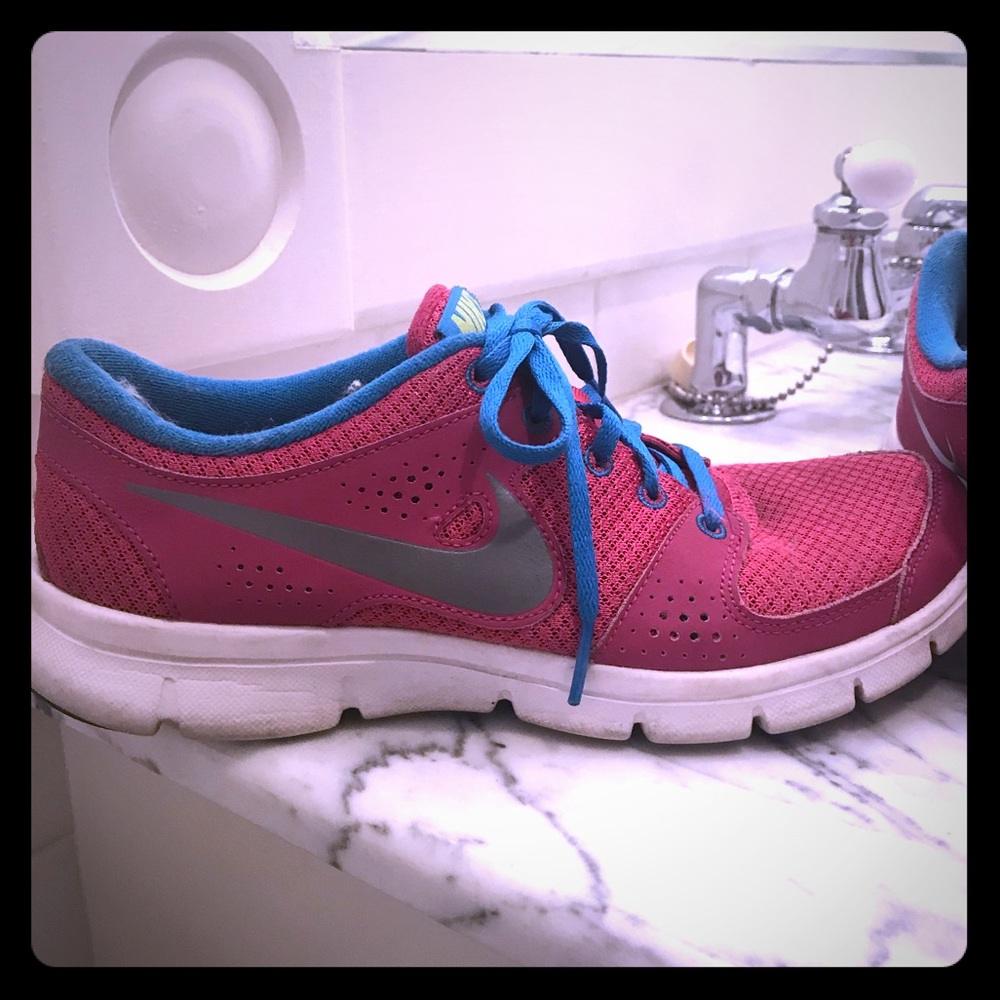 Pink and blue Nike tennis shoes